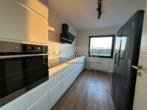 moderne, hochwertige Küche 1 - Hochwertig sanierte 3-Zimmer-Wohnung -modernes Wohnen mit toller Aussicht auf die angrenzende Natur!